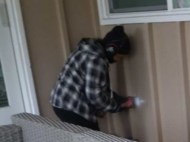 Professional electrician installing an exterior outlet in Rockport